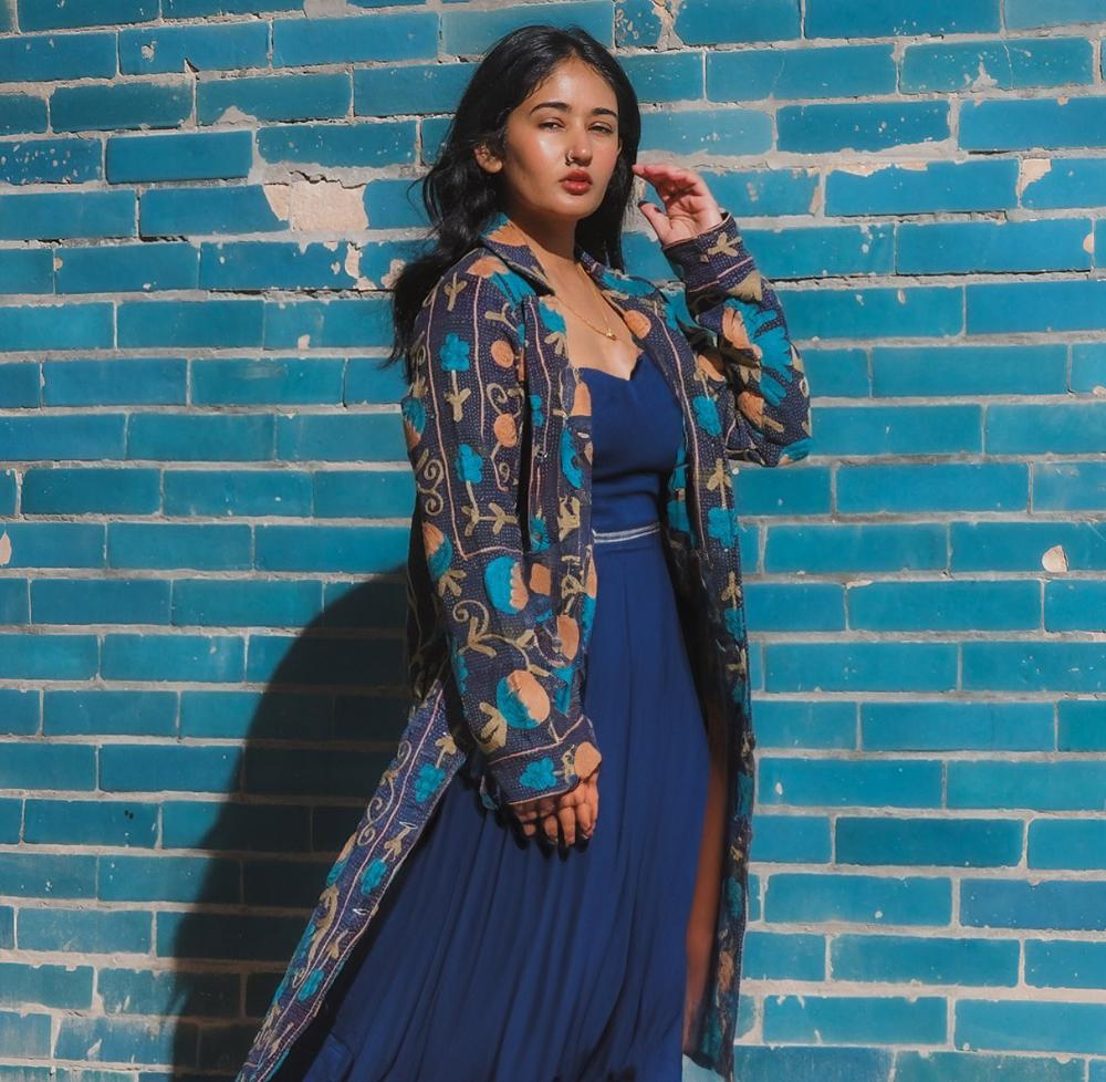 Shilpa wearing Transcend's Nadia bomber jacket made with vintage kantha fabric
