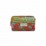 A rectangular zippered pouch with a colorful patchwork quilted fabric design, featuring a red floral pattern on the bottom, yellow and blue striped patterns on the top, and a central white brand label that reads 'TRANSCENO Artisan Made'. 1