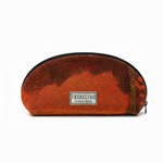 A translucent zippered pouch with a textured orange and brown pattern, featuring a white rectangular label that reads 'TRANSCEND Artisan Made'. 1